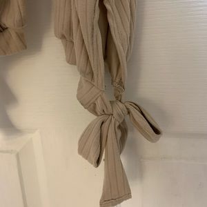 Super cute beige jump suit with tie ankles